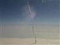 Plane passenger snaps photo of shuttle launch