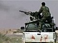 Libya: Gaddafi forces fight rebels on road to Sirte