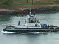 Royalty Free Stock Video HD Footage Tugboat Leaves the Harbor in Honolulu,  Hawaii