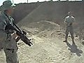 Soldier tests gun on friend