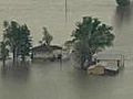 U.S. levee holed in flood battle