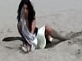 Hot girl in a bikini catches a seagull