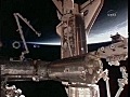 Shuttle Atlantis docks with ISS