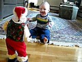 Baby Fascinated By Dancing Santa