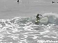 Surfer Lands A Kick Flip