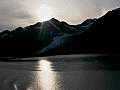 Royalty Free Stock Video SD Footage Zoom Out to Mountains and Bright Sun in College Fjord,  Alaska