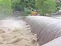 Buses Cross Flooded Bridge