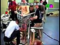 Paraplegic man stands assited with epidural stimulation