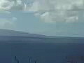 Royalty Free Stock Video SD Footage Pan Left to Island Mountain Range on Molokai Island and View of North Shore Coastline in Maui,  Hawaii