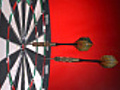 Darts hitting dartboard,  multiple shots, slow motion