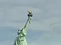 Royalty Free Stock Video SD Footage Approaching the Statue of Liberty,  as Seagulls Fly By, Shot From a Ferry in New York City With Twin Towers Skyline in Background