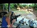 Girl Shooting lots of Guns