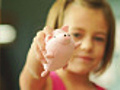 Little girl plays with stuffed pig