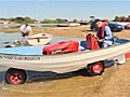 Amphibious vehicle made from lawnmower and rowing boat