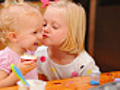 SIsters enjoy cupcakes