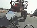 Motorcycle Drives Under Truck