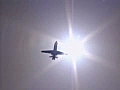 Royalty Free Stock Video SD Footage Jet Plane Flying In Sunny Blue Sky