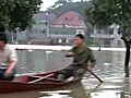 Chinese return to flooded homes as authorities say more rain is to come