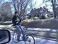 Backwards Bike Rider Plays Ukulele