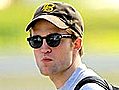 Robert Pattinson Handles His Own Baggage