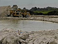 Royalty Free Stock Video SD Footage Heavy Equipment Loader and Dump Trucks Move Dirt at a Quarry in Broward County,  Florida