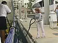 Royalty Free Stock Video SD Footage Crew Member Unhooks a Bow Line at the Docks in Ft. Lauderdale,  Florida