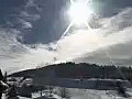 Royalty Free Stock Video HD Footage Pan Right From Bright Sun to Ski Lift on a Winters Day in Beaver Creek,  Colorado