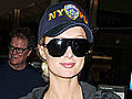 Paris Hilton Rummages Through Her Bags at JFK