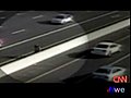 Two Men Fight on a Highway