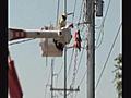 Crews Fix Snapped Power Poles