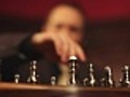 Hero plays chess,  the butler observes him