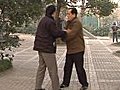 Two Martial Artists Sparring In Shanghai Park Stock Footage