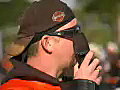 Royalty Free Stock Video SD Footage Man Talks on a Cell Phone at the Fun in the Sun Toy Run in Ft. Lauderdale,  Florida in 2003