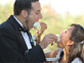 Bride and groom at wedding feed each other cake