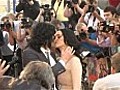Russell Brand locks lips with Katy Perry and Helen Mirren at Arthur premiere
