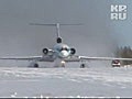 TU-154 takes off from snow covered ground after a runway overshoot