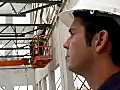 Royalty Free Stock Video SD Footage General Contractor Points to a Steel Worker at a Construction Site in Ft. Lauderdale,  Florida