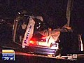 Woman dies in crash with police car
