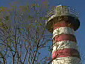 Royalty Free Stock Video HD Footage Tree Branches and a Lighthouse in Jersey City,  New Jersey