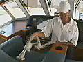 Royalty Free Stock Video SD Footage Cabin Attendant Vacuums the Interior on a Yacht in Ft. Lauderdale,  Florida