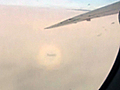 Caught on Tape: Rainbow surrounds airplane