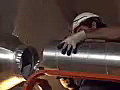 Royalty Free Stock Video SD Footage HVAC Worker Attaches Air Duct at a Construction Site