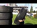 ONE FIT GUY - MUSCLES AND A STACK OF TYRES