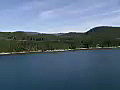 Royalty Free Stock Video SD Footage Pan From Shoreline to Cruise Ship Deck in the Inside Passage Waterway,  Alaska