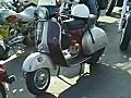 Royalty Free Stock Video SD Footage Zoom Out to a Motor Scooter at the Fun in the Sun Toy Run in Ft. Lauderdale,  Florida in 2002