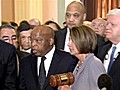 House Democrats walk pass protesters