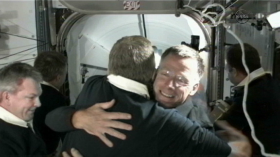 ISS and Atlantis astronauts greet