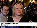 Man makes funny faces behind reporter