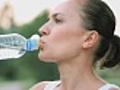 Woman drinking water after sport activities,  shot at 60fps