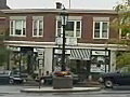 Royalty Free Stock Video SD Footage Zoom Out From an Intersection as Traffic Passes by on an Autumn Day in Amherst,  Massachusetts